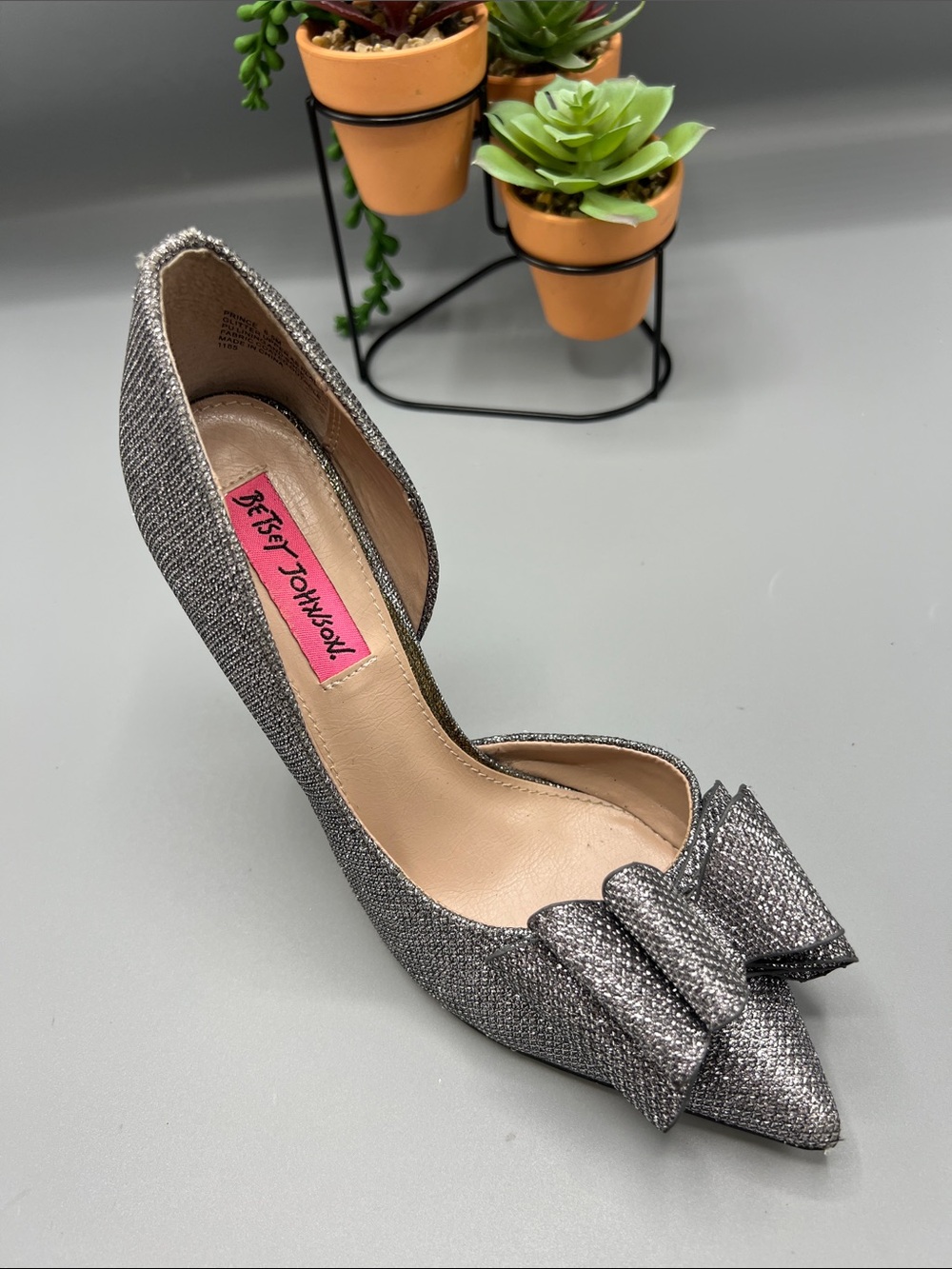 Betsey Johnson Silver Glitter Pointed Toe Bow Pump out of smoke